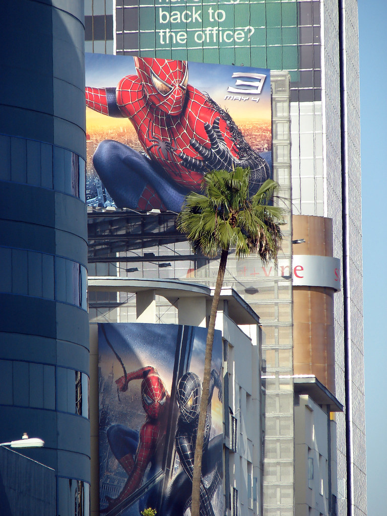 Spiderman, reclining on palm tree
