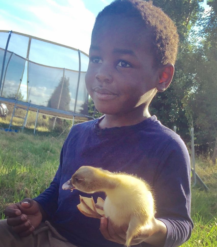 Just a boy and his duckling.